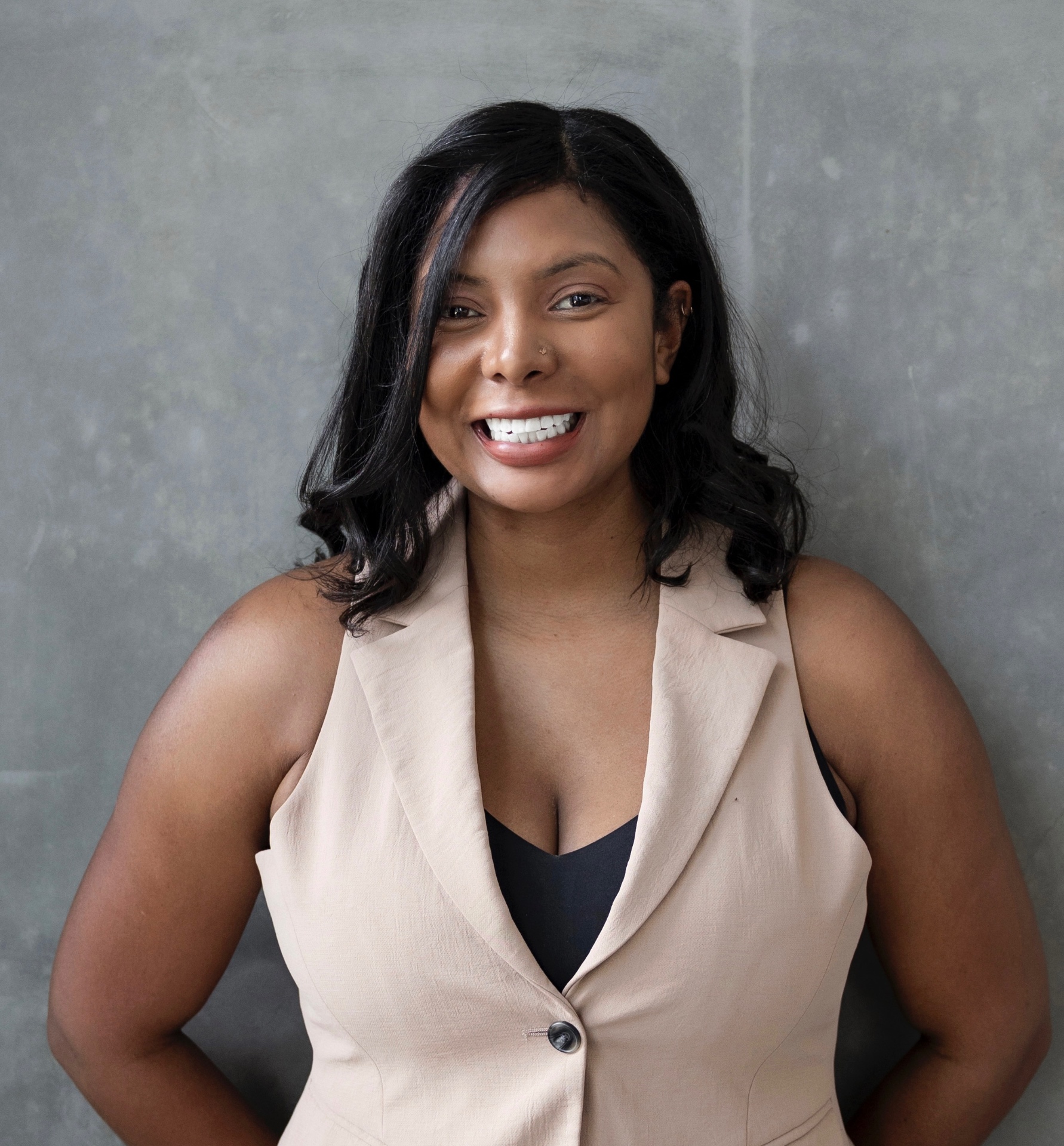 Ashleigh Evans professional portrait in tan blazer